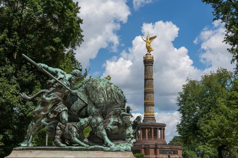 Fasanerieallee and hunting sculpture Old Germanic buffalo hunting in the zoo with a view of the