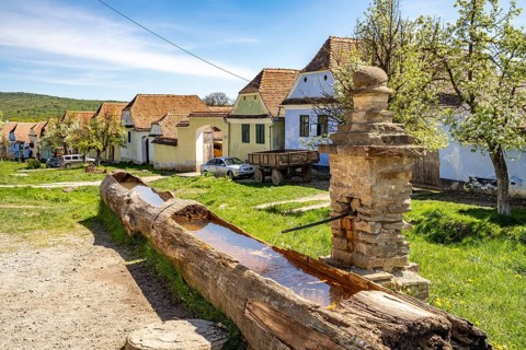 Wooden fountains and traditional Transylvanian-Saxon farms in Viscri or Deutsch-Weisskirch,