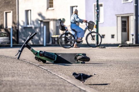 Rental scooter, e-scooter, left at the sidewalk, in Essen, North Rhine-Westphalia, Germany