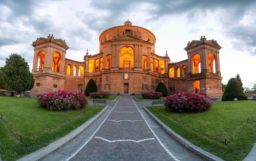 Illuminated Santuario Madonna di San Luca church on the hills of Colle della Guardia, in the