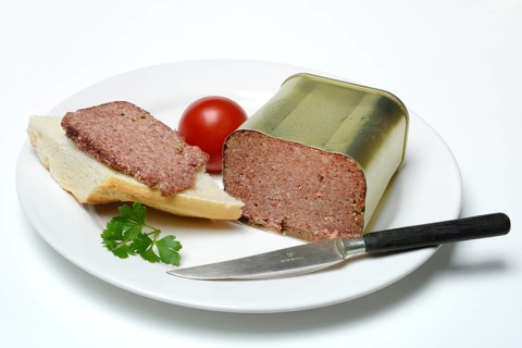 Canned corned beef, beef on plate with knife