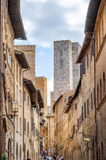Old Town with stone arches and historic buildings of San Gimignano, Tuscany, UNESCO World Heritage,