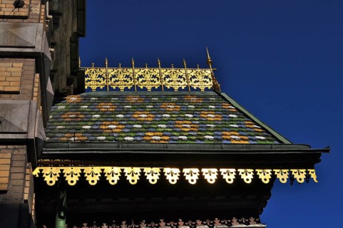 Detailed roof with colorful tiles and gold ornaments of the Church of the Resurrection under deep