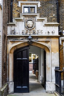 Secret London. The arched gatehouse of Clifford's Inn bears its name in raised lettering below a