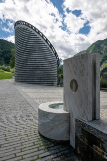Modern fountain sculpture in front of the Roman Catholic church of San Giovanni Battista, built on