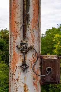 Old plastic switches on a steel column at the Historic Cable Car Diversion Station in the