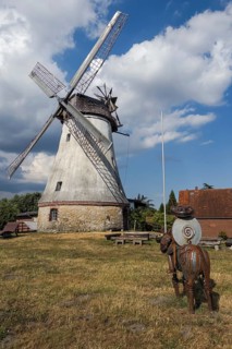Historic windmill with Don Quixote in Lechtingen, Wallenhorst, Lower Saxony, Germany