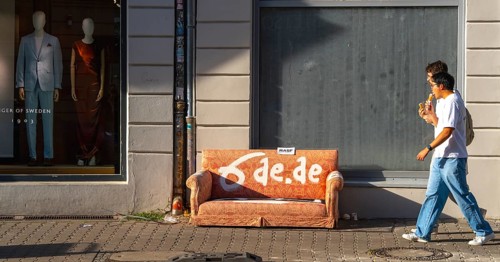 Garbage parked on public roads, couch in orange, Neue Schönholzer Straße, Berlin, Germany