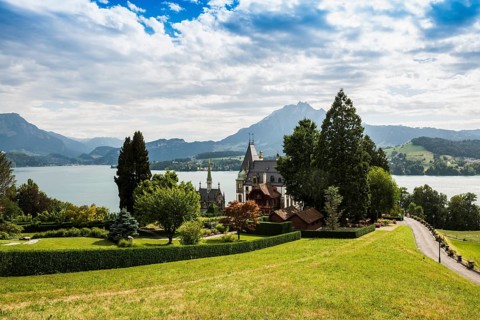 Picturesque castle with lakeside park in the mountains, Meggenhorn Castle, Meggen, Lake Lucerne,