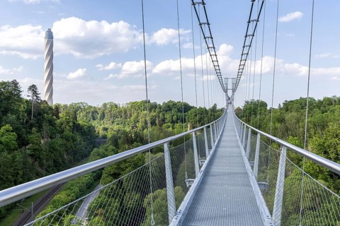 Neckarline suspension bridge over the Neckar and TK elevator test tower in Rottweil, Germany