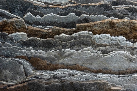 Geological formation of sandstone and limestone layers, Flysch on Itzurun Beach in Zumaia, Spain
