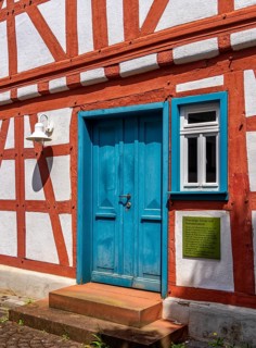 Entrance to the former school and local history museum with teachers' apartment in the back part of