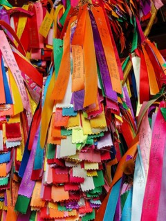 Many colorful ribbons with wishes hangs in the temple. Georgetown, Penang, Malaysia, colorful