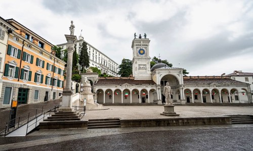 Piazza della Libertà main square with Loggia e Tempietto di San Giovanni and clock tower, Castello