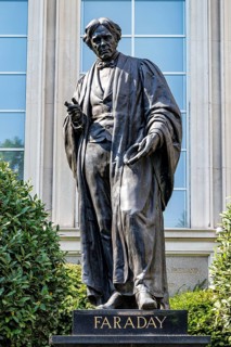 A bronze statue of Michael Faraday stands outside the Institution of Engineering and Technology on