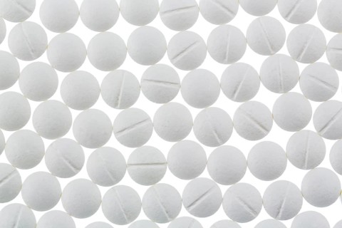 White tablets, symbolic photo of medicine, remedies and tablet addiction