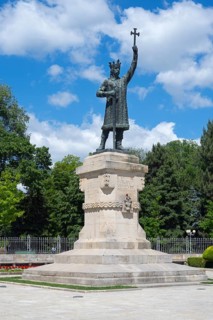 Large monument with a statue of a man holding up a cross, Stephen the Great Memorial, Chisinau,