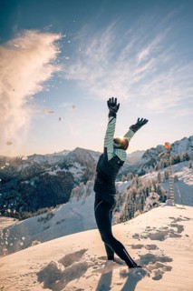 Summit bliss in the snow-covered winter landscape in the Tannheimer Tal in the Alps on the