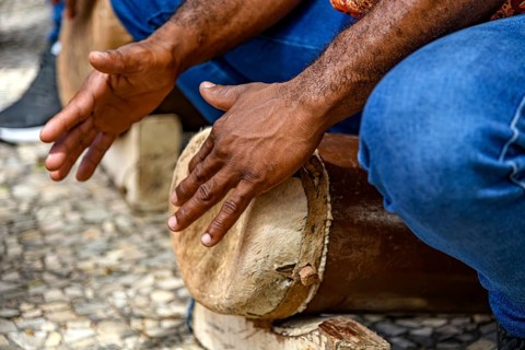 Man playing a drum typical of the *tambor de crioula* in the state of Maranhao, Brazil, Sao Luis,