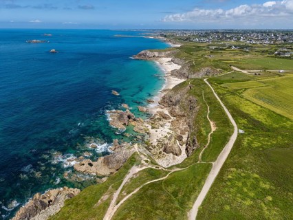 Aerial view of the sandy beach, Plage des Charettes beach north of Pointe Corsen, a cape at the