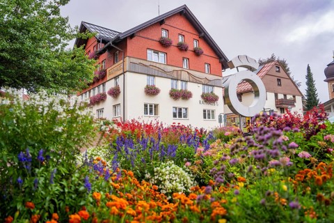 Beautiful flowers in front of the town hall in an idyllic setting, Oberstaufen, Allgäu, Bavaria,