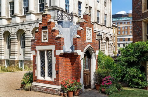 This front view of Ostler's Hut at Lincoln's Inn shows its arched doorway and small glass window,