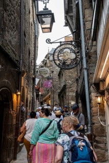 Mass tourism in the historic alleys of Rocky Island, Le Mont Saint Michel monastery island, tourist
