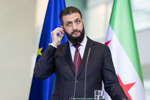 Ahmed al-Sharaa (President of the Syrian Arab Republic) at a joint press conference with Friedrich