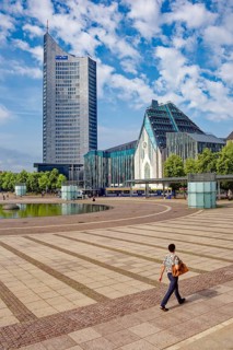 Morning atmosphere, Leipzig Augustusplatz with city skyscraper and university, reflection, water