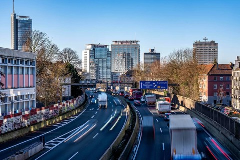 The A40 motorway, Ruhrschnellweg, in Essen, city skyline, Evonik office building, traffic jam in