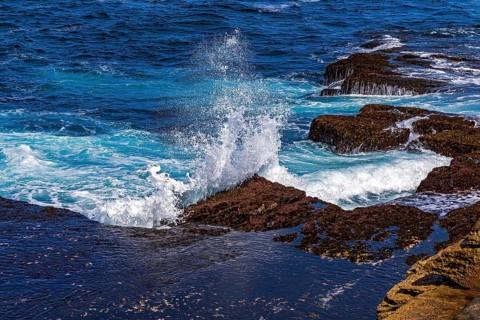 Waves crash into rocks on the coastline at Maroubra, Sydney, New South Wales, Australia