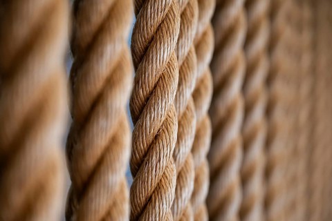 Close-up of several twisted thick ropes hanging close together, Strandingsmuseum St. George, North