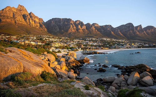 Evening on the coast, beach near Camps Bay, with table mountains, blue sea, Cape Town, South Africa