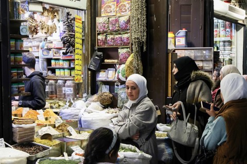 Syrians shop at the historic Al-Hamidiyah Bazaar adjacent to the Umayyad Mosque during the early