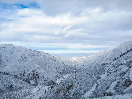 Winter mountain landscape against the blue sky with clouds. Winter landscape, A serene winter