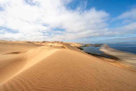 Sand dunes and sea, Atlantic coast and sandy desert with sea of dunes, view of lagoon at Sandwich