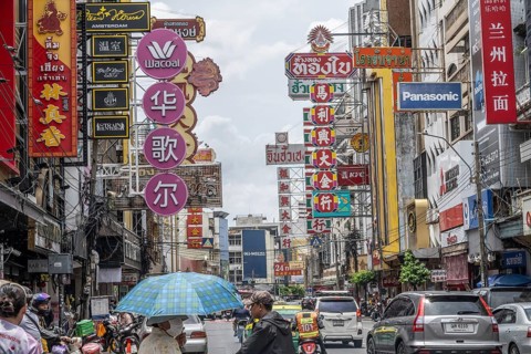 Bangkok, Thailand. August 24th 2026. Busy traffic and neon signs along Yaowarat Road in the