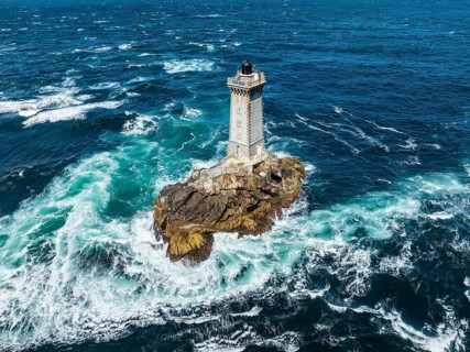 Aerial view of the historic Phare de la Vieille lighthouse, built from 1882 to 1887 on a rocky reef