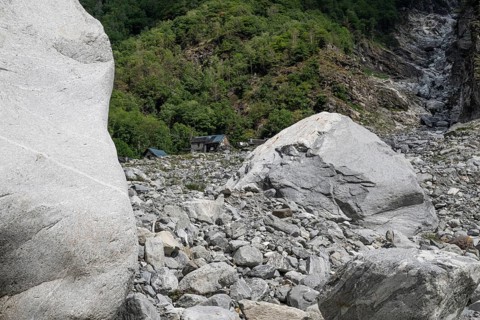 Devastation caused by debris and boulders, as a result of heavy rock and debris flow on the night