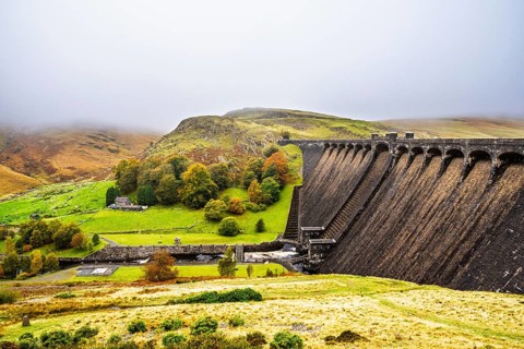 Autumn colors over Claerwen Dam, Claerwen Valley, Elan Valley Reservoir, Rhayader, Powys, Wales, UK