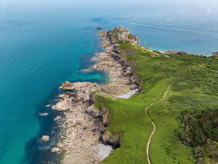 Aerial view of the historic rock castle Fort la slat, Château de la Roche Goyon on a rocky headland