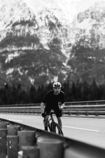 Road bike rider in spring between Lechtal and Tannheimer Tal in front of picturesque scenery of the