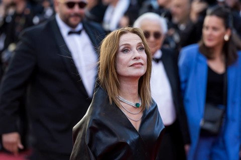 Isabelle Huppert with Karma on the Red Carpet at the Palais des Festivals et des Congrès during the