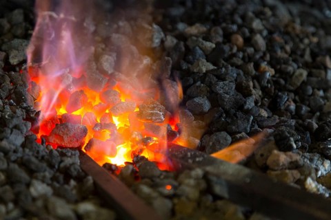 A blacksmith forging, working at the Ehnert forge in Dresden-Bühlau, Saxony, Germany