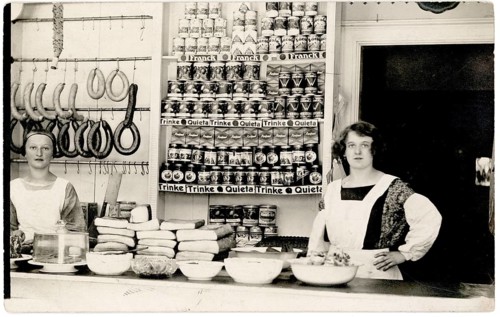 Colonial goods, shop, profession, twenties, saleswoman, shop display, interior view of a grocery