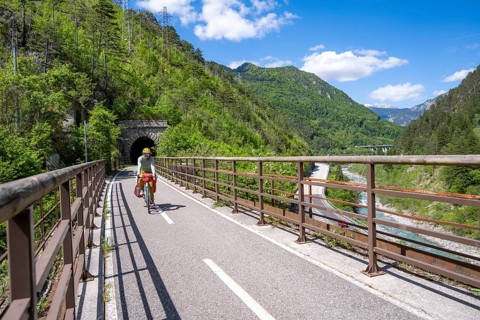 Cyclists with panniers on a cycle path, cycle path along the old Pontebba railway line in the Canal