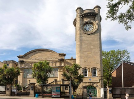 Clocktower and posters at the Horniman Museum building, Forest Hill, south London, SE23 England, UK