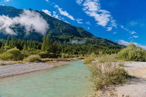 Isar valley nature conservancy area. The wild Isar river flows on a sunny morning through its