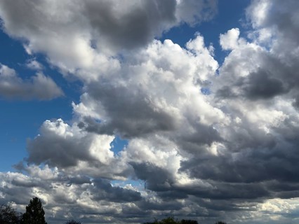 Large cloud field of dark cumulus cluster clouds at the bottom announce rain rain clouds rain