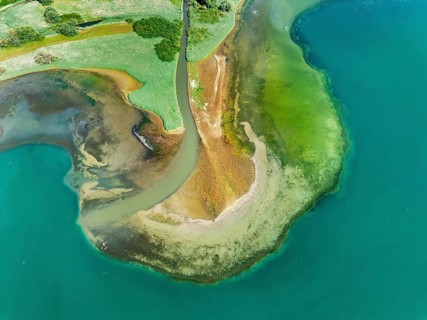 Aerial view, top-down view of the mouth of the Stockacher Aach at low tide flowing into Lake